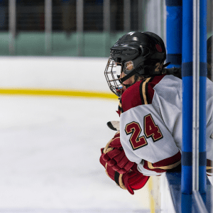 Ice Hockey player hanging out of the penalty box