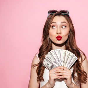 picture of woman holding money