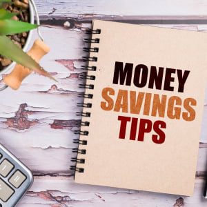 picture of book stating Money Saving Tips and calculator