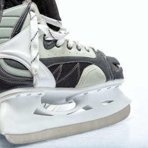 Picture of a ice hockey skate showing book, blade, holder of an ice skate