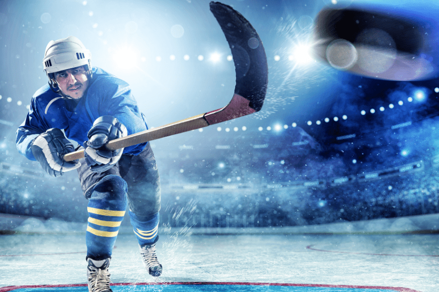 Ice Hockey player taking a slap shot 